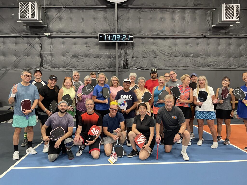 group of pickleball players at RECS in Portland's best pickleball community in Oregon posed after playing in a recreational league